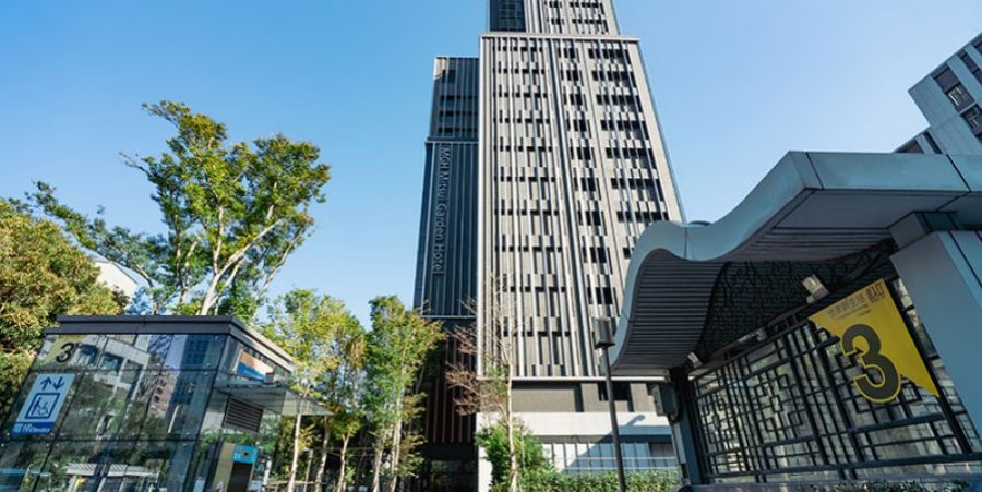 A high-rise structure with a significant large window at its base.